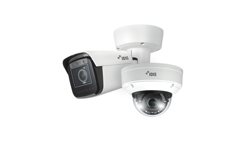 Front of zip tote bag with white canvas, black canvas straps and handle, and black zipper pulls.